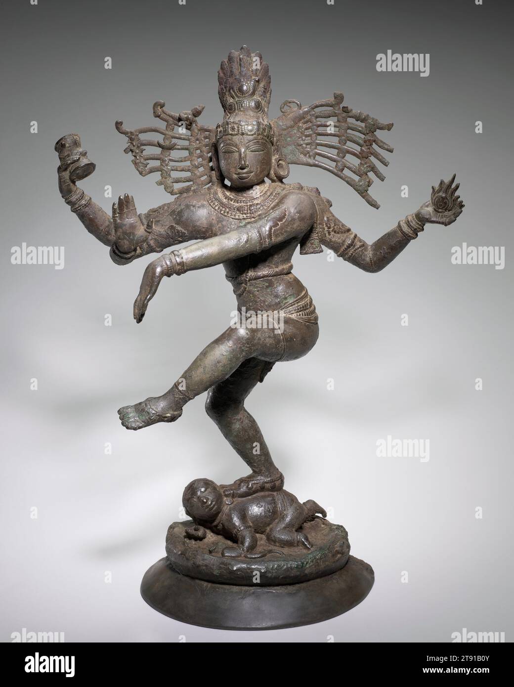 Shiva Nataraja (Lord of the Dance), c. 1100, 28 in. (71.12 cm), Bronze, India, 11th or 12th century, The Hindu god Shiva appears in several incarnations. Here, Shiva appears as Nataraja, or Lord of the Dance. He raises his left foot in a graceful dance pose. In his upper right hand, Nataraja holds a drum, the sound of which manifests creation. The flame that he holds in his upper left hand symbolizes destruction. Together, they symbolize the creation and destruction of the cosmic universe. The posture of the icon’s lower left and right palms signifies protection. Stock Photo