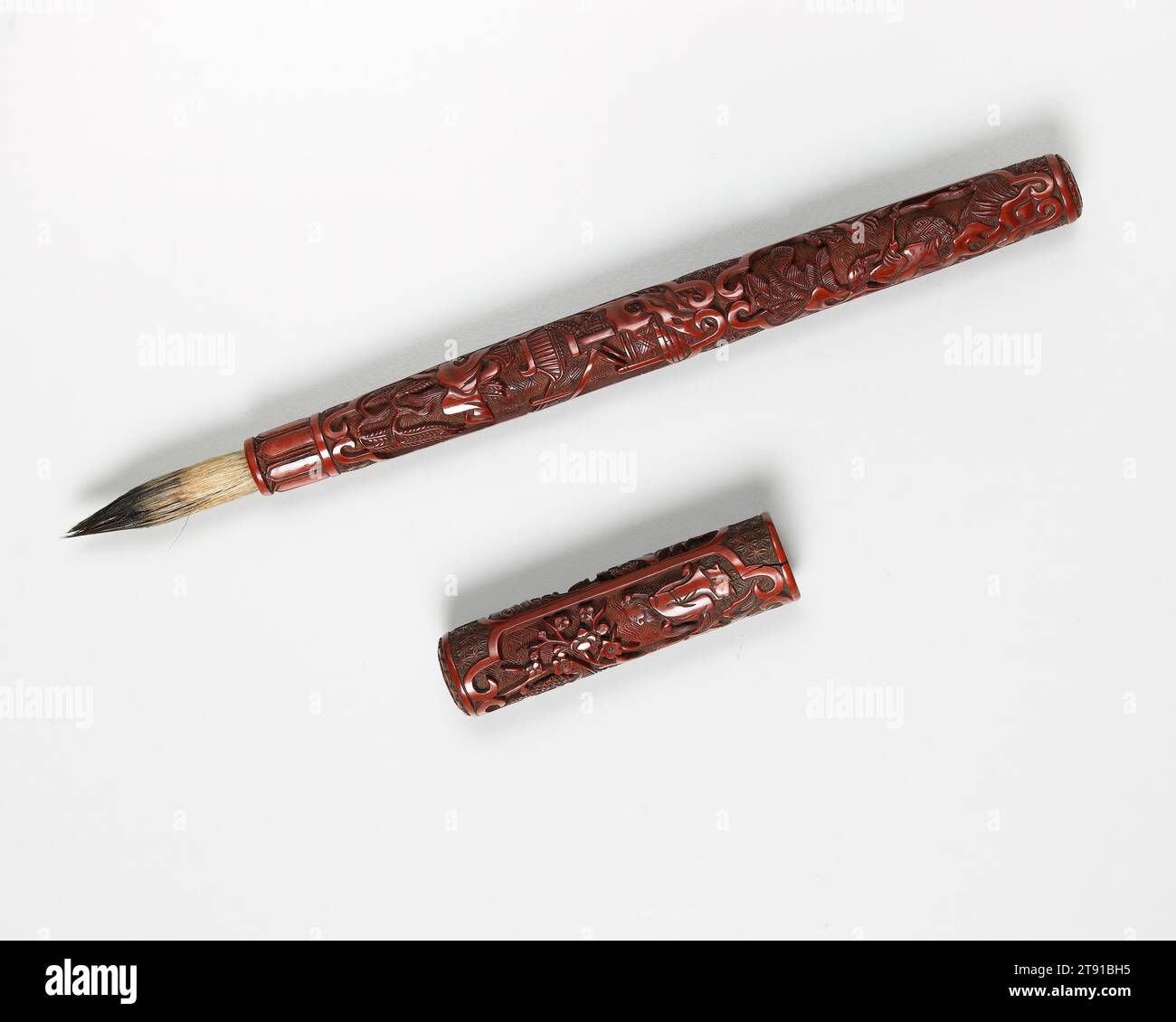 Brush Handle and Cover, late 15th-early 16th century, 8 7/16 x 5/8 x 5/8 in. (21.4 x 1.6 x 1.6 cm), Carved red lacquer (t'i-hung), China, 15th-16th century, During Ming and Qing, lacquer was used for a variety of scholar's implements including brushes, dusters,ju-i scepters, seal paste boxes, and incense containers. In spite of the small size, this brush handle and cover are decorated with a remarkable number of carved motifs. The handle has three landscape scenes with scholarly figures among winding bridges, fantastic rocks, and terraced buildings. Trees include willow, pine, and banana Stock Photo