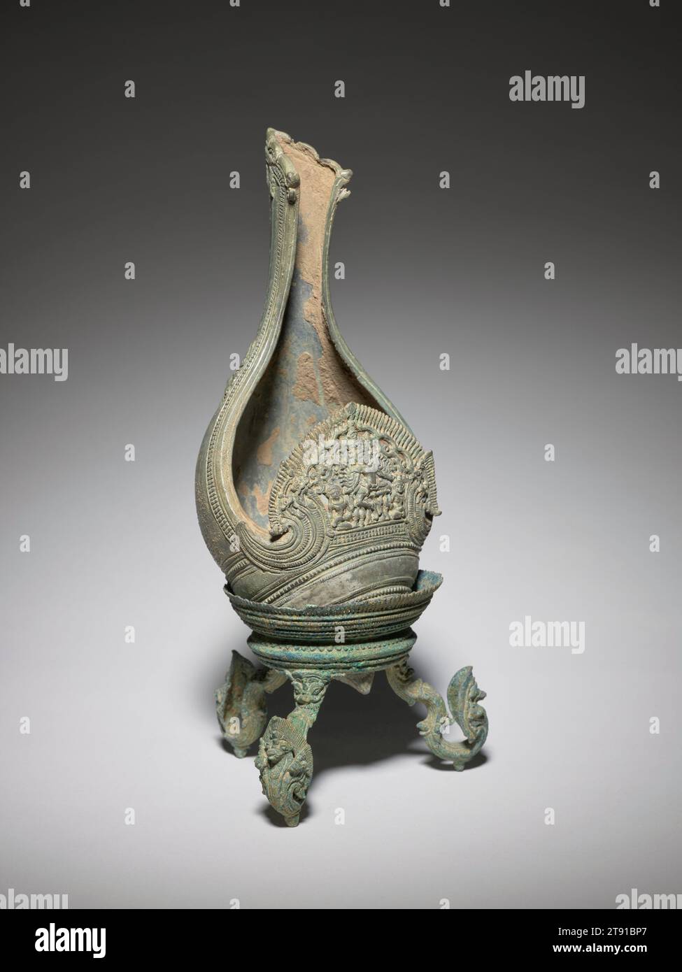 Buddhist ritual conch shell with a dancing Hevajra, 12th-13th century, Bronze, Cambodia, 12th-13th century, This bronze takes the form of a conch shell, a vessel used in both Buddhist and Hindu rituals. Blown at the beginning of ceremonies, the instrument makes the sound of the sacred syllable 'Om,' believed to purify the mind before meditation. Buddhism and Hinduism were often practiced side by side in the kingdoms of Southeast Asia; however, Hinduism was the official religion of Khmer kings until the conversion to Buddhism of Jayavarman VII (reign c. 1181–1218) Stock Photo