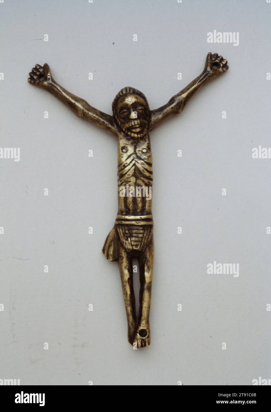 Crucifix, 19th century, 5 1/8 x 5 1/4 in. (13 x 13.3 cm) (figure), Brass, Democratic Republic of the Congo, 19th century, The Kongo kingdom flourished from 1450 to 1700 as a vast, centralized African state on the Atlantic coast south of the equator. Christianity was adopted as a state religion at the end of the 15th century, and over the next 200 years Portuguese missionaries introduced crucifixes, devotional objects, and figures of saints, all of which were copied by Kongo artists. Incorporated into local religious practices that combined the two traditions, objects like this small crucifix Stock Photo