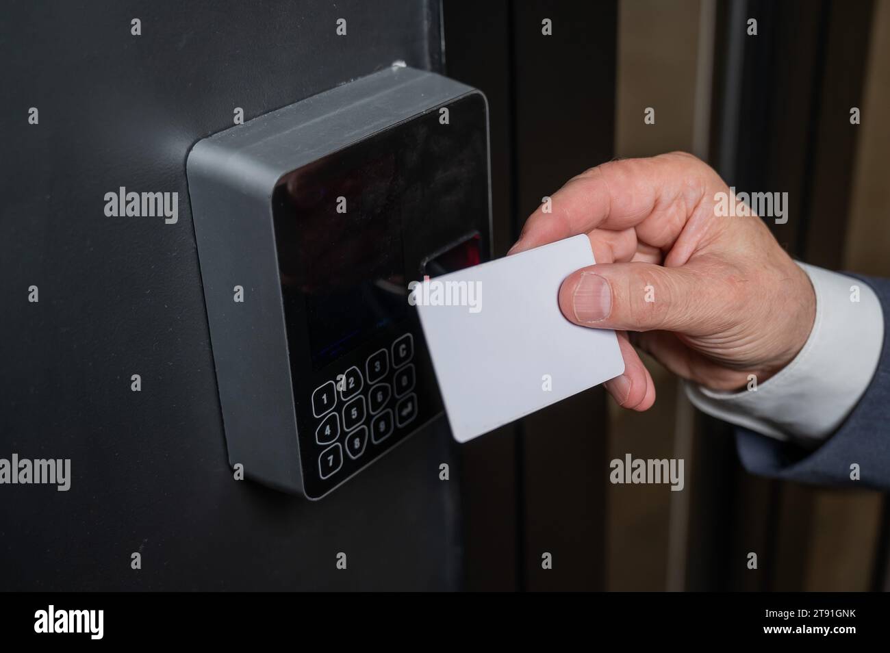 A man opens the door with a card. Modern electronic lock. Keyless Entry ...