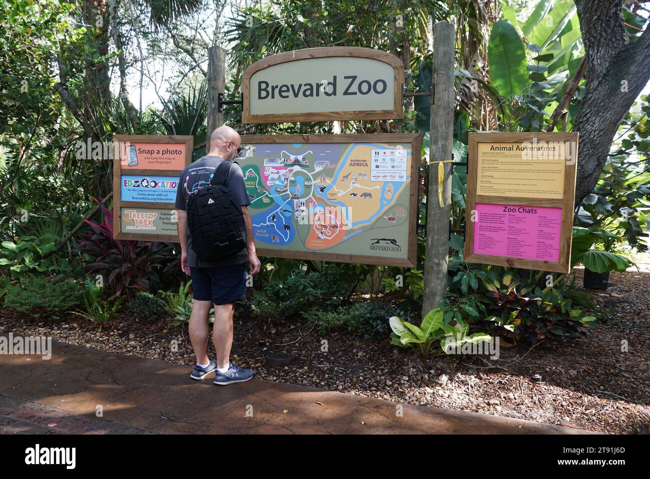 Melbourne, Florida, U.S.A - November 12, 2023 - A man reading the map and information at Brevard Zoo Stock Photo