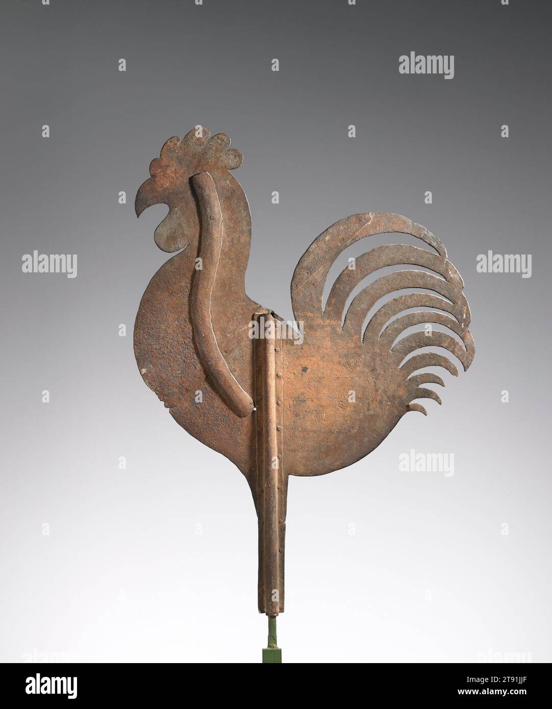 Rooster weathervane, c. 1860, 39 x 27 in. (99.06 x 68.58 cm), Iron, United States, 19th century, For townspeople of the 1700s and 1800s in America, reading the weather was simply a matter of looking up. Weathervanes graced the roofs of meeting halls and churches in the town center. Farmers and others who lived outside of town often made their own weathervanes. Early examples like this highly stylized rooster from Bucks County, Pennsylvania, were usually two-dimensional and hand cut from wood or sheet metal Stock Photo