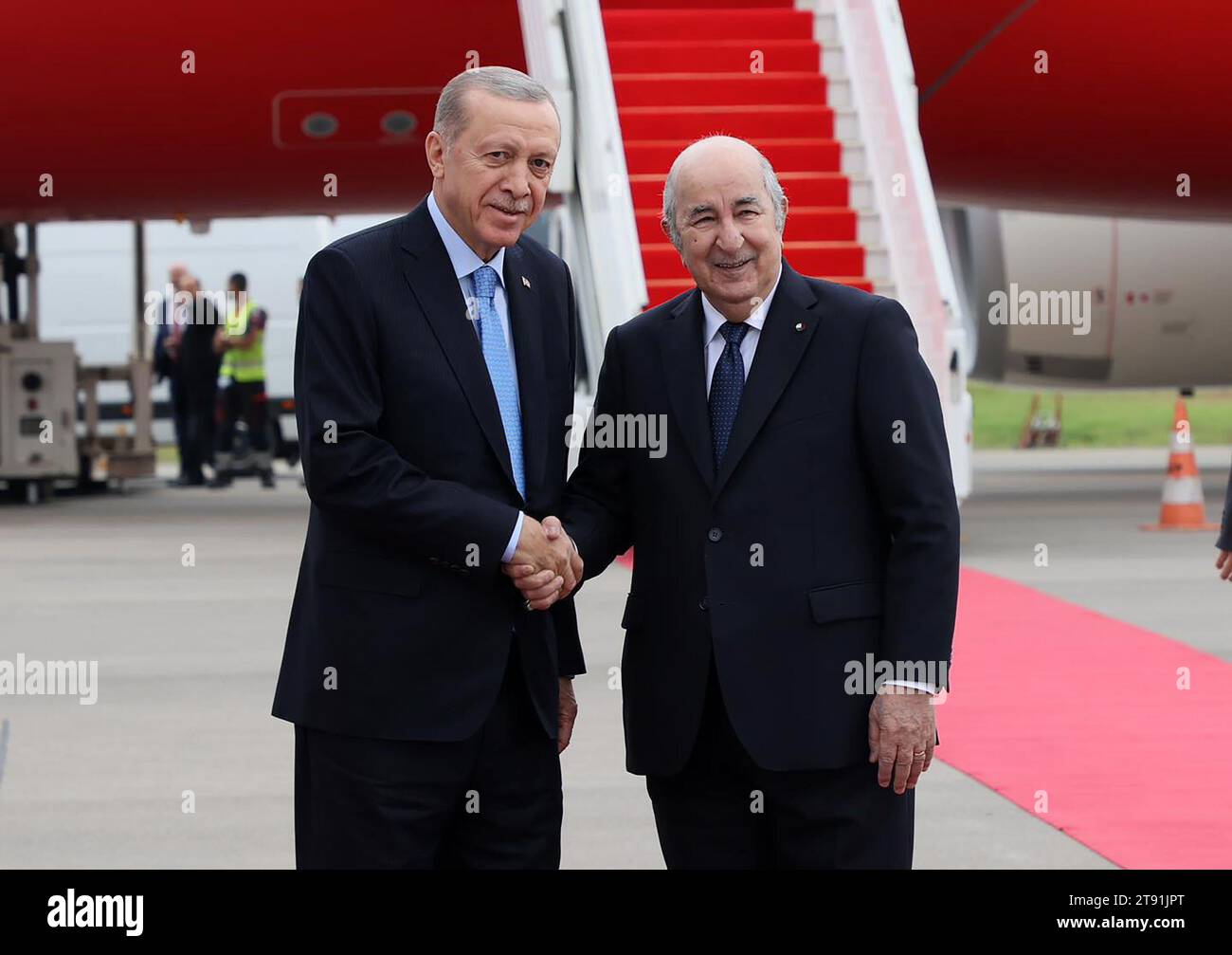 (231122) -- ALGIERS, Nov. 22, 2023 (Xinhua) -- Algerian President Abdelmadjid Tebboune (R) welcomes Turkish President Recep Tayyip Erdogan in Algiers, Algeria, Nov. 21, 2023. Algeria and T¨¹rkiye on Tuesday sealed 13 agreements and memorandums of understanding (MOU) on boosting bilateral cooperation during the visit of Turkish President Recep Tayyip Erdogan. (Algerian Presidency/Handout via Xinhua) Stock Photo