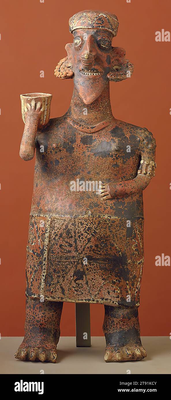 Figure, c. 100-200, 28 x 5 1/2 in. (71.1 x 14.0 cm), Clay, pigments, Mexico, 1st-2nd century, Although Nayarit sculptors are better known for their small-scale ceramics, they also created large hollow figures. This impressive example represents a woman. She is shown holding a vessel for food or drink and wears a patterned headband, skirt, and elaborate jewelry. It was likely produced as part of a pair depicting a man and a woman. Couple figures in Nayarit, Jalisco, and Colima art from West Mexico were likely more than just marriage pairs. Placed in deep shaft tombs Stock Photo