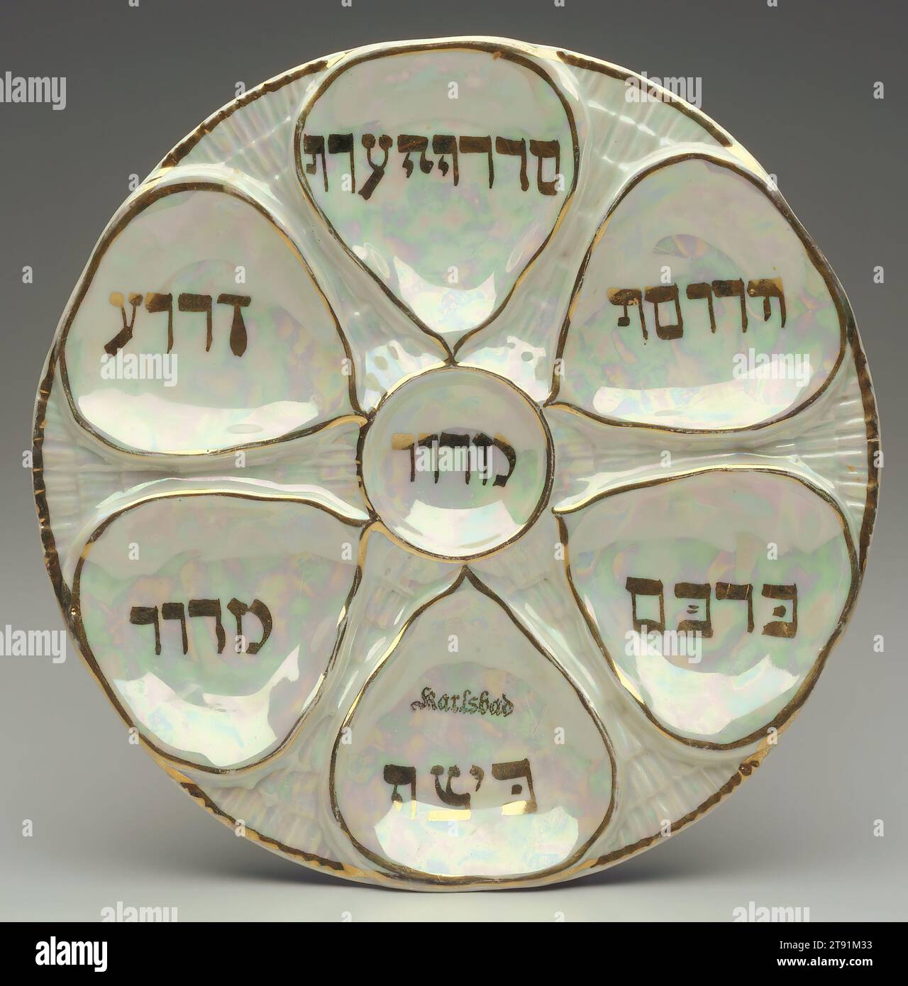 Seder plate, c. 1880-1890, 1 5/16 x 9 1/2 in. (3.33 x 24.13 cm), Ceramic, Czechoslovakia, 19th-20th century, This Seder plate was owned by a German Jewish couple who escaped from Germany in 1938 to Shanghai, China. They subsequently immigrated to the United States, where the donor obtained the plate from them Stock Photo