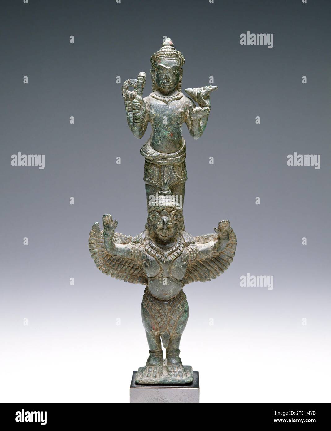 Vishnu on Garuda, 12th-13th century, 7 1/8 x 3 1/8 x 1 7/16 in. (18.1 x 7.94 x 3.65 cm), Bronze, Cambodia, 12th-13th century, In Hinduism, Vishnu is the preserver and maintainer of the established order. Whereas Shiva is Lord of the Beginning and of the End, Vishnu is the deity who oversees the middle ground, avoids extremes, and maintains orthodoxy. The standard depiction of Vishnu is four-armed standing upright wearing a crown. He carries a conch shell, lotus, a club, and a discus. His vehicle is the bird Garuda depicted here in the usual form as part human, part bird Stock Photo