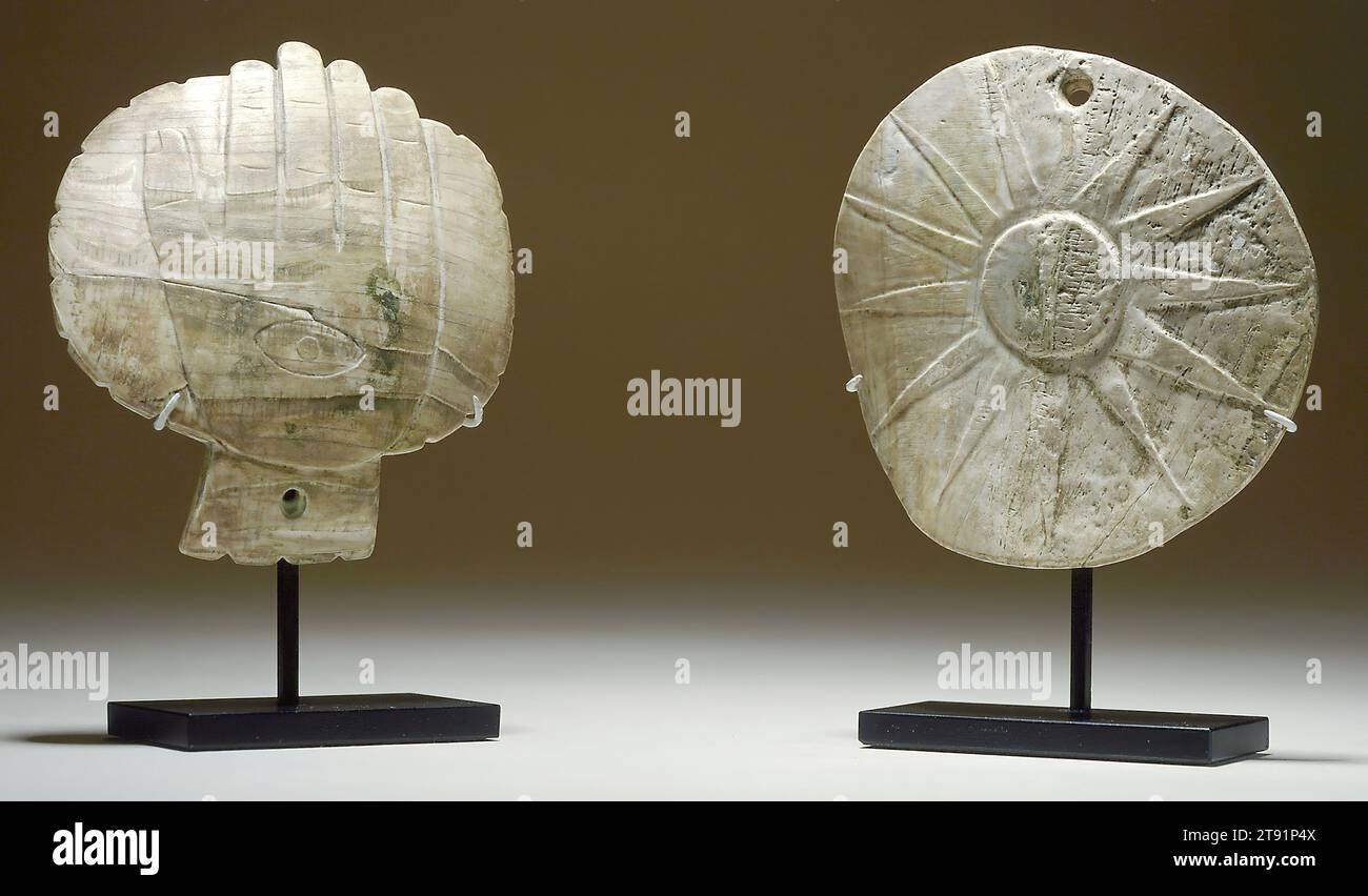 Gorget, c. 1200-1350, 1/4 x 4 1/4 in. (0.64 x 10.8 cm), Shell, United States, 12th-14th century, These large gorgets were carved out of conch shell traded all the way in from the Gulf Coast. Worn as chest ornaments, they were a marker of influence and standing in ancient Mississippian culture. Each has prominent celestial imagery, depicting important elements of the Above World. The sun is the chief divinity, represented in this realm by fire. The Hand and Eye motif signifies the constellation that marks the entrance to the Path of Souls in the sky, the Milky Way. Stock Photo