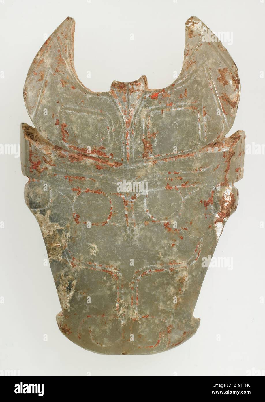 Bull-Head Pendant, 1766-1122 BCE, 2 3/4 x 1 13/16 x 5/16 in. (6.99 x 4.6 x 0.71 cm), Grey-blue jade with calcification and traces of red pigment, China, 18th-12th century BCE Stock Photo
