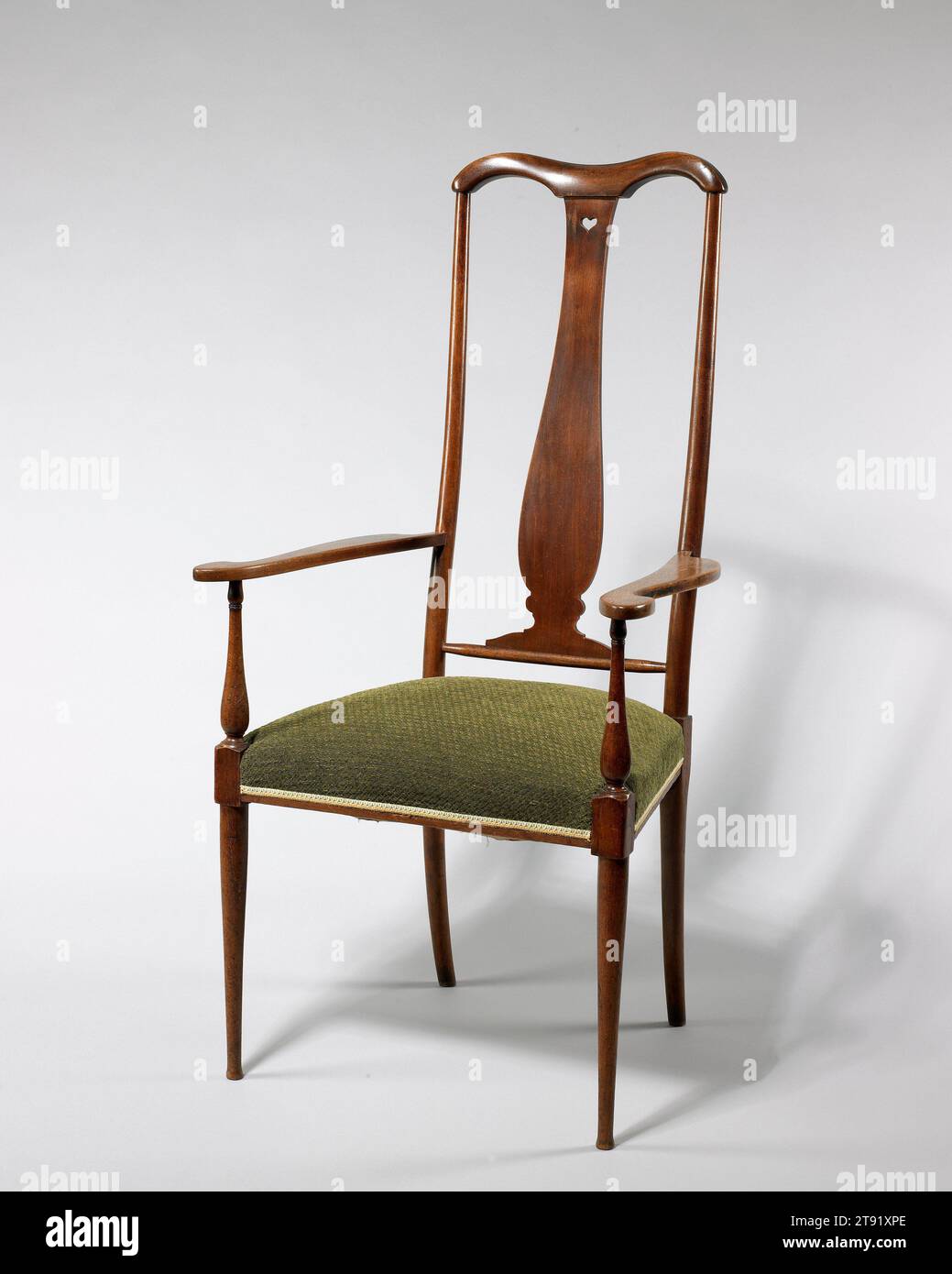 Brussels' armchair, c. 1901, George Walton, Scottish, 1867-1933, 48 x 24 x 20 in. (121.92 x 60.96 x 50.8 cm), Walnut, upholstery, England, 19th-20th century, Architect and interior designer George Walton studied at the Glasgow School of Art before establishing a design firm in Glasgow in 1888. He decorated numerous homes and businesses in the Glagow area, including the Argyle Street tea-room and the Buchanan Street tea-rooms with Charles Rennie Mackintosh. Stock Photo