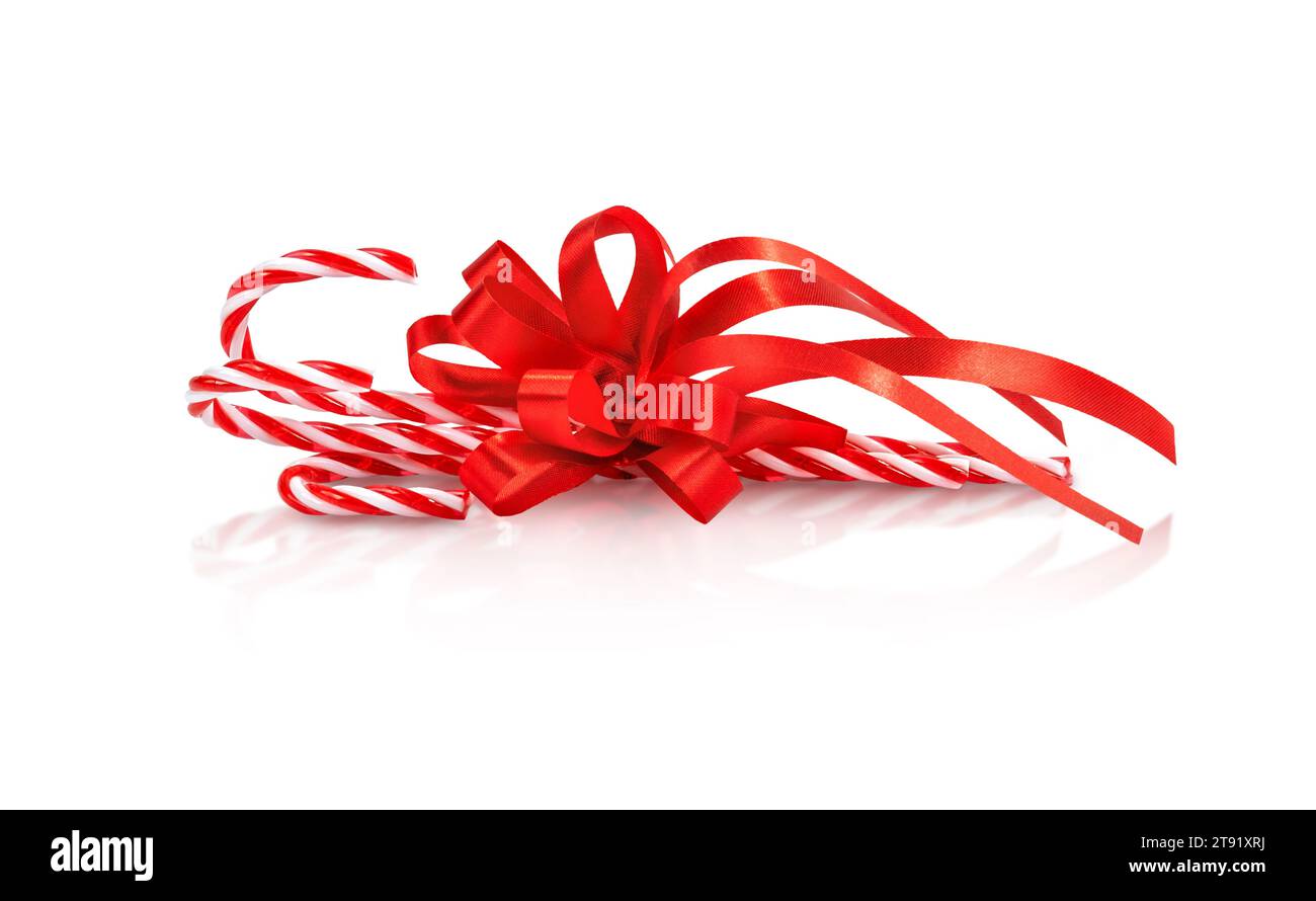 Christmas candy cane with red bow isolated on white background Stock Photo