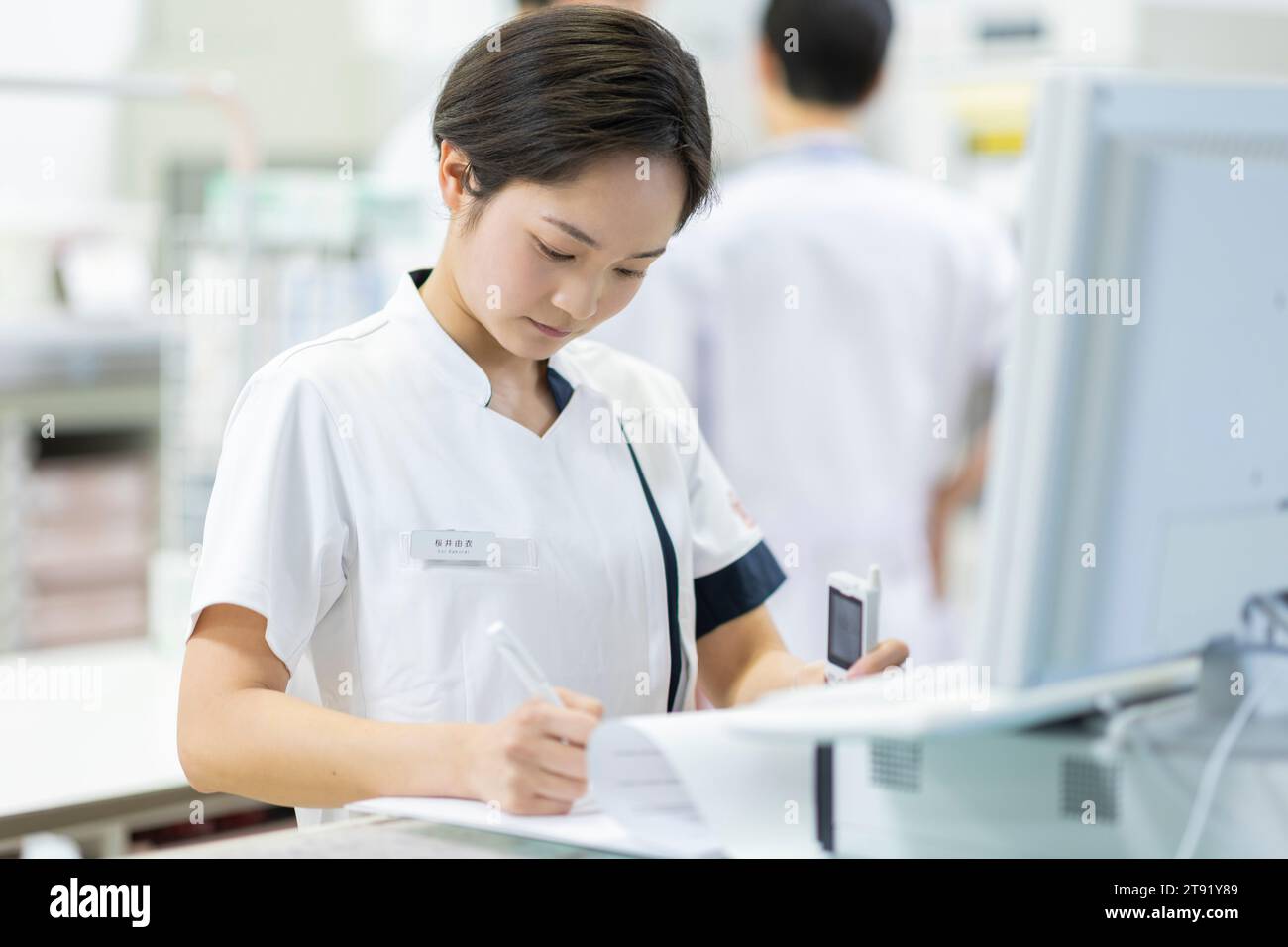 Nurse looking at electronic medical record Stock Photo Alamy