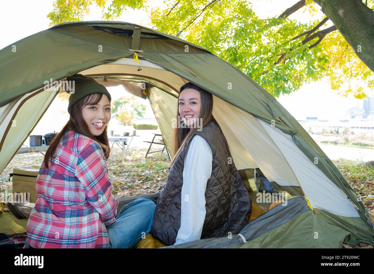 Two women enjoying camping Stock Photo