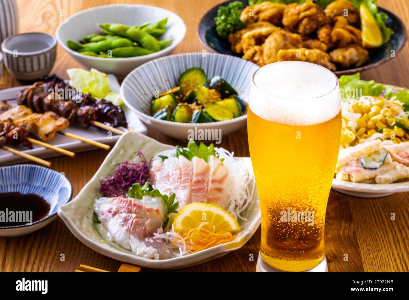 Draft beer and food at a Japanese izakaya Stock Photo Alamy