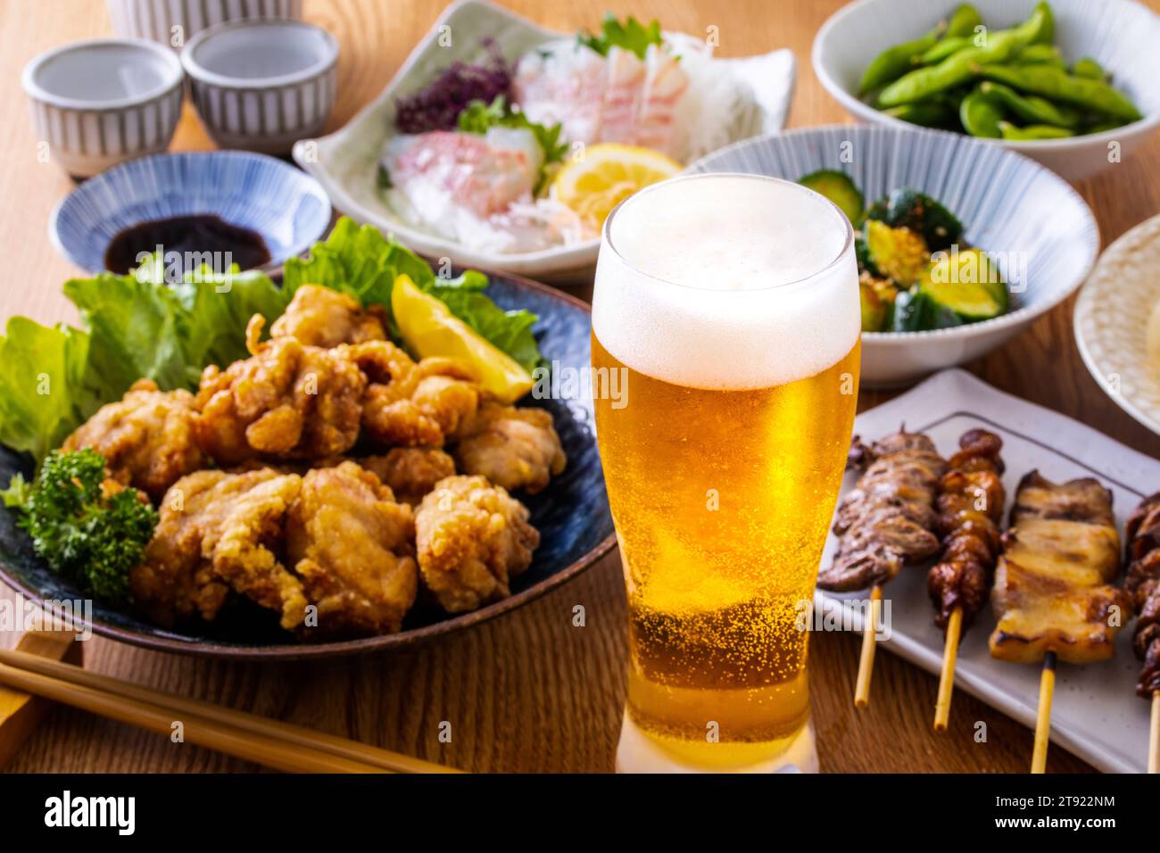Draft beer and food at a Japanese izakaya Stock Photo Alamy