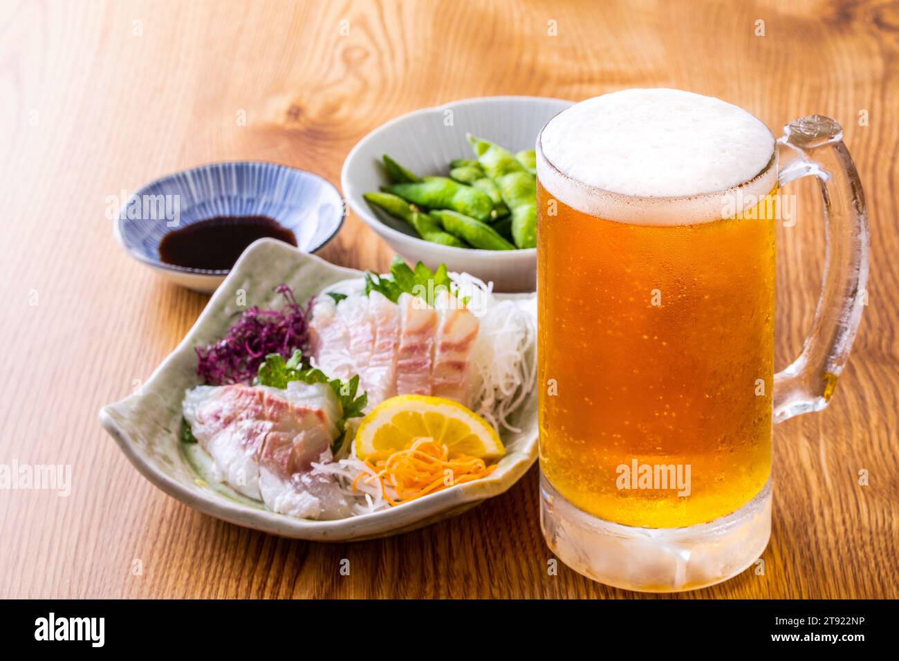Draft beer and food at a Japanese izakaya Stock Photo Alamy