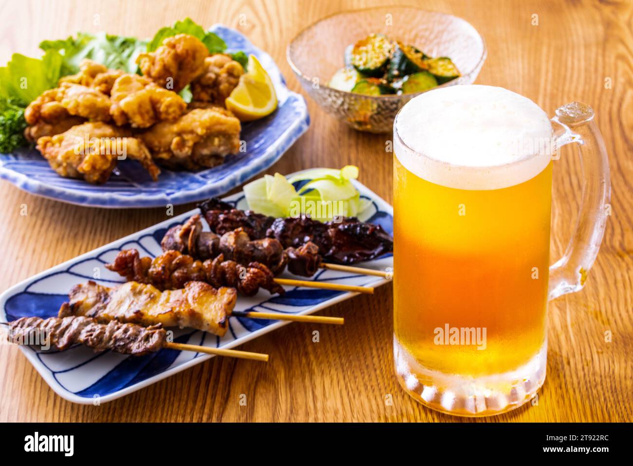 Draft beer and food at a Japanese izakaya Stock Photo Alamy