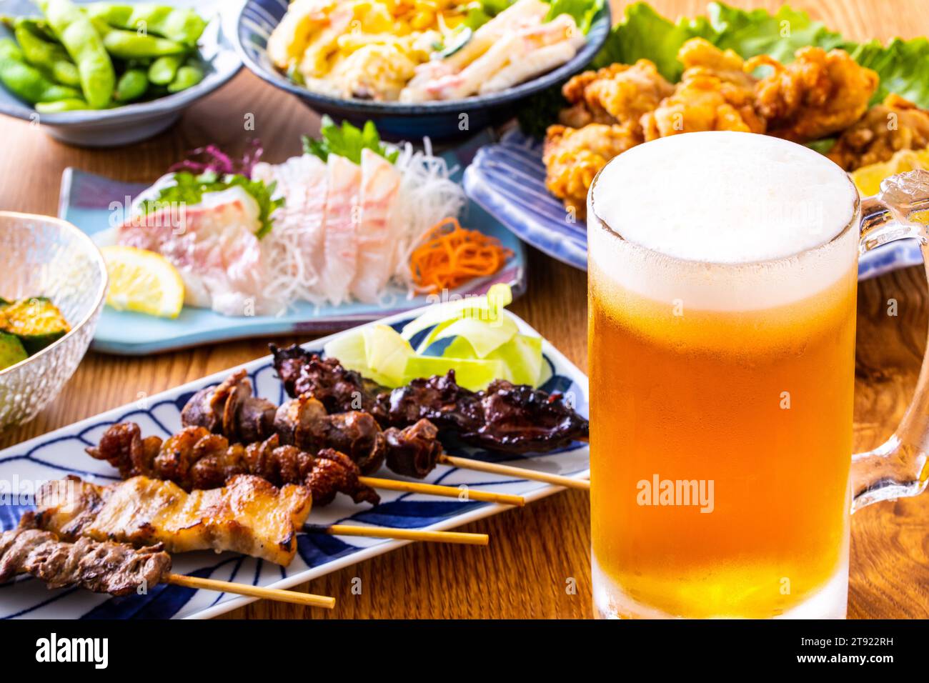 Draft beer and food at a Japanese izakaya Stock Photo Alamy