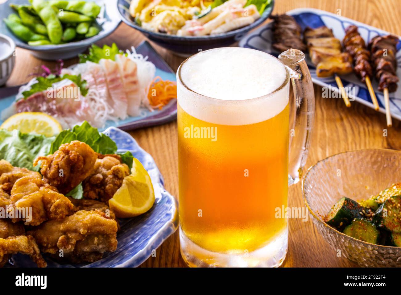 Draft beer and food at a Japanese izakaya Stock Photo Alamy