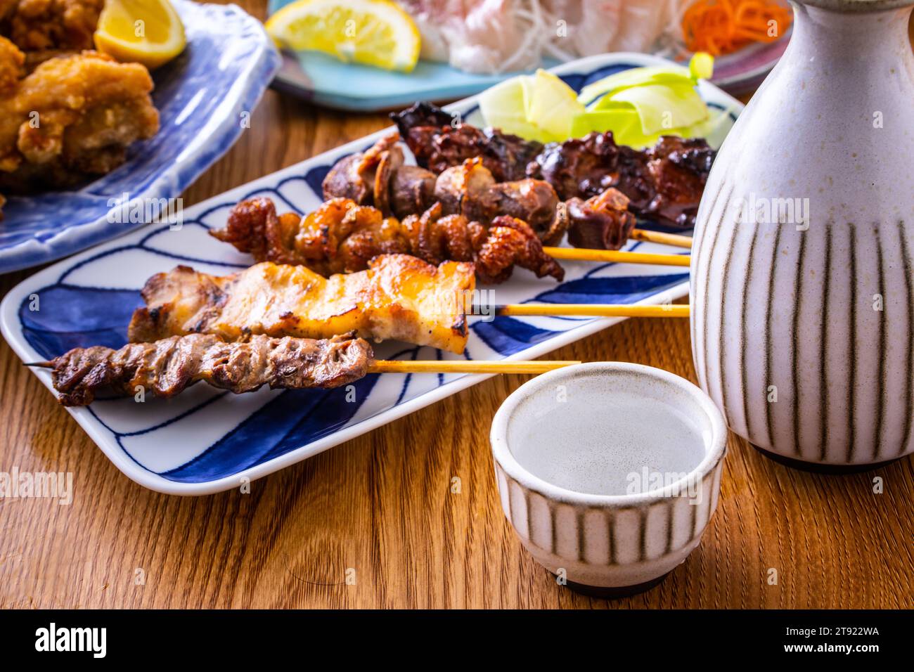 Japanese sake and food at a Japanese izakaya Stock Photo