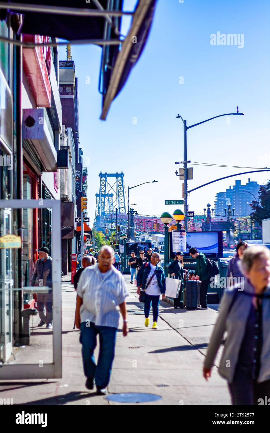 People walking near the Williamsburg Bridge on the Lower East Side of Manhattan, New York City Stock Photo
