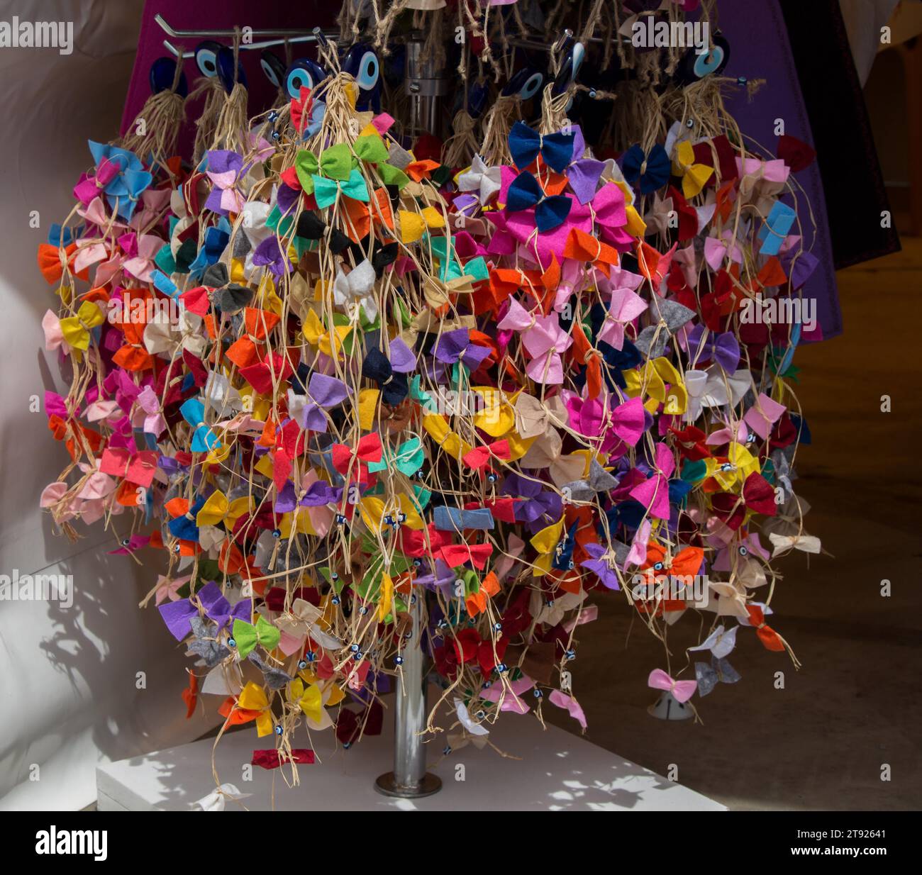 Collection of colored bows and ribbons on threads Stock Photo - Alamy