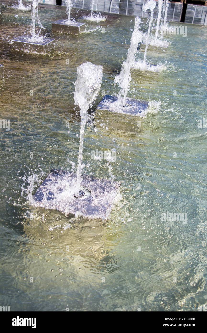 The fountains gushing sparkling water in a pool in a park Stock Photo ...