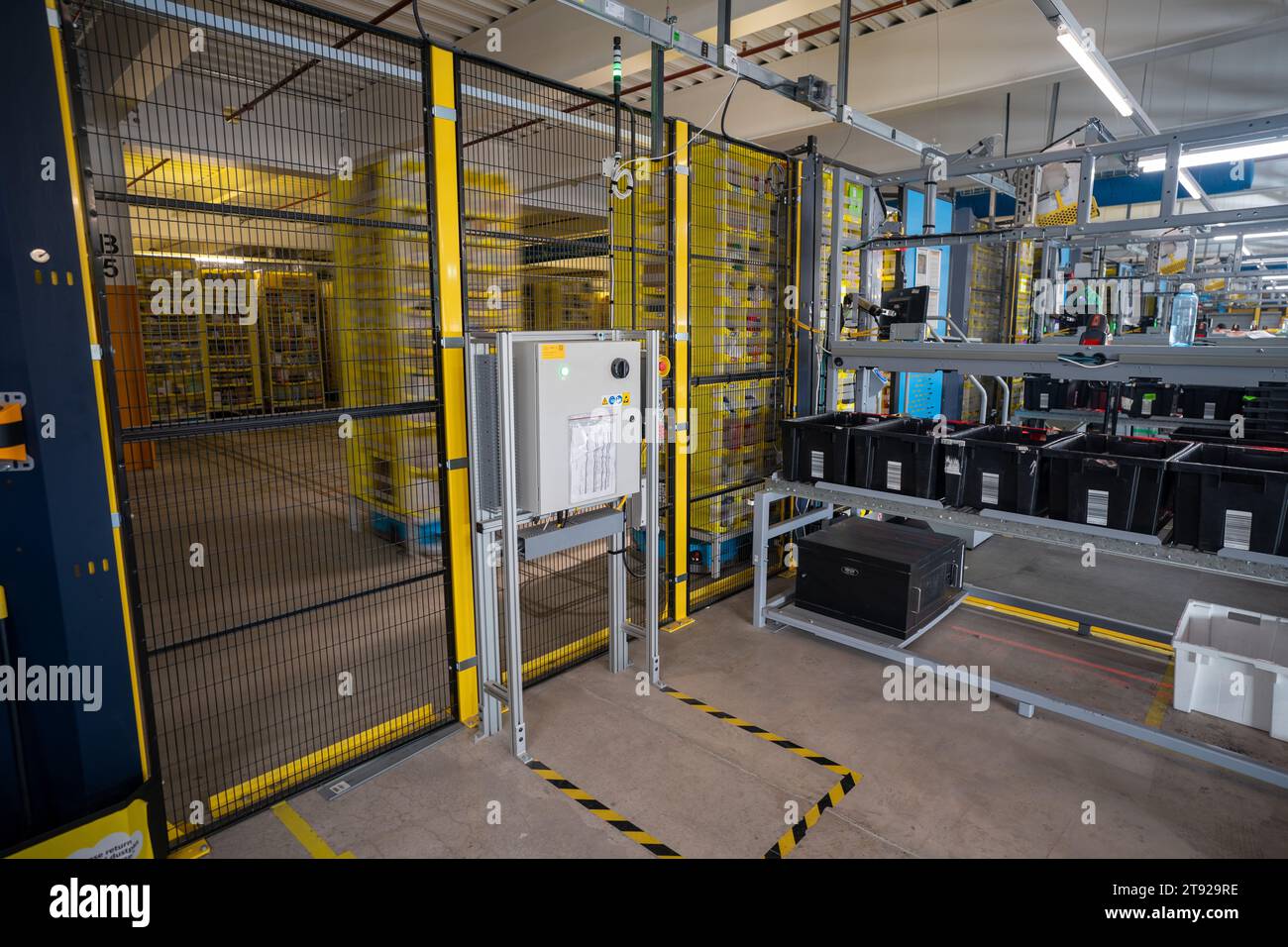 Yellow shelves move around on blue automated robots, called Hercules ...