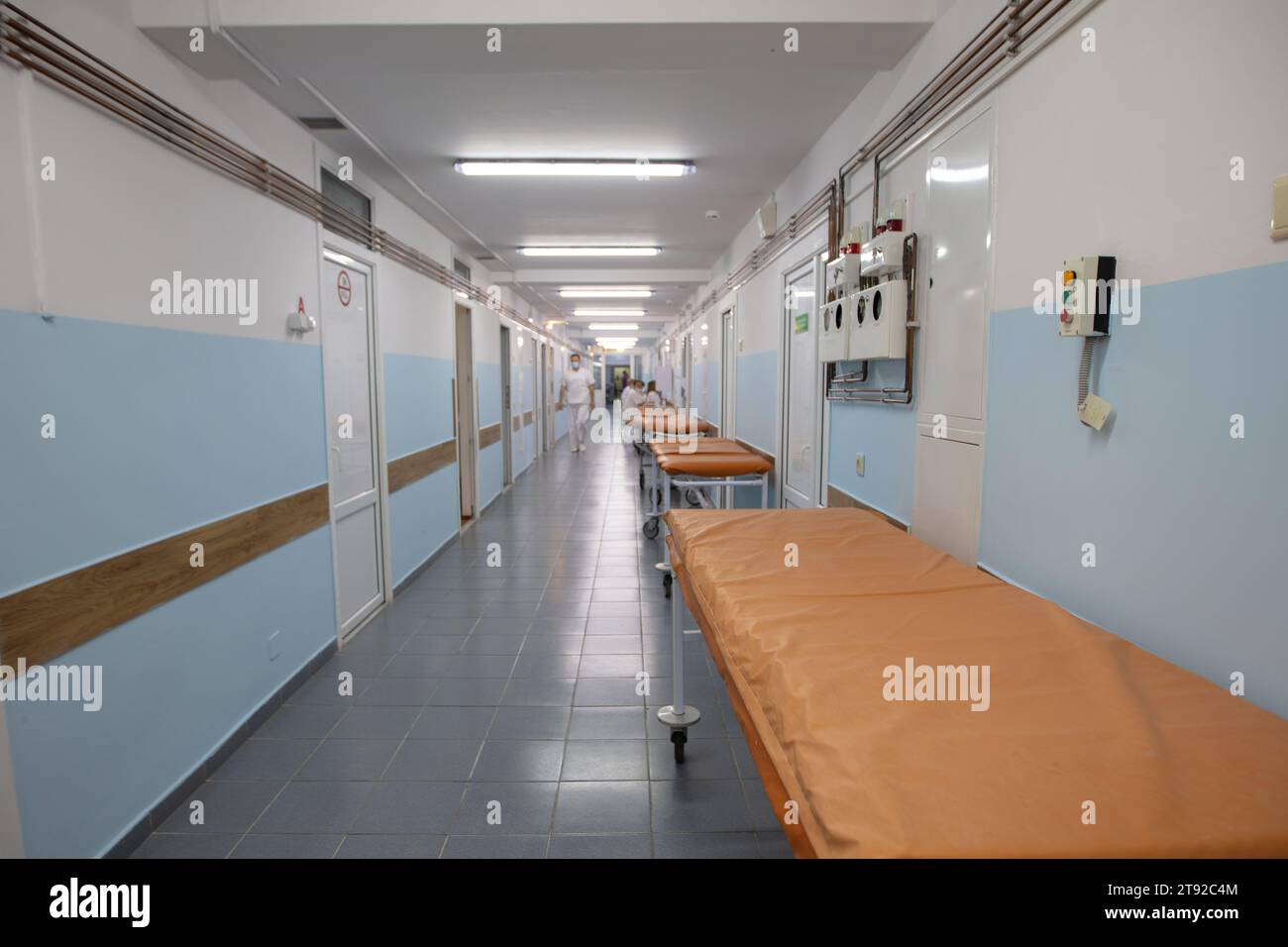 The long medical corridor of the hospital with doctors and medical