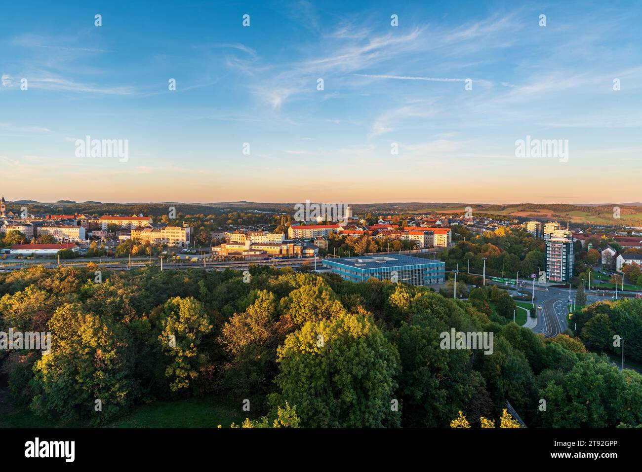 Plauen Vogtland Oberer Bahnhof railway station from lookout tower on Barenstein hill in Plauen city in Germany during autumn sunset Stock Photo