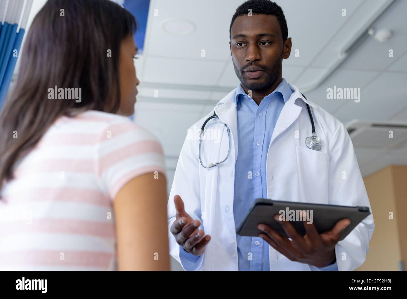 Doctor talking patient room hi-res stock photography and images - Alamy