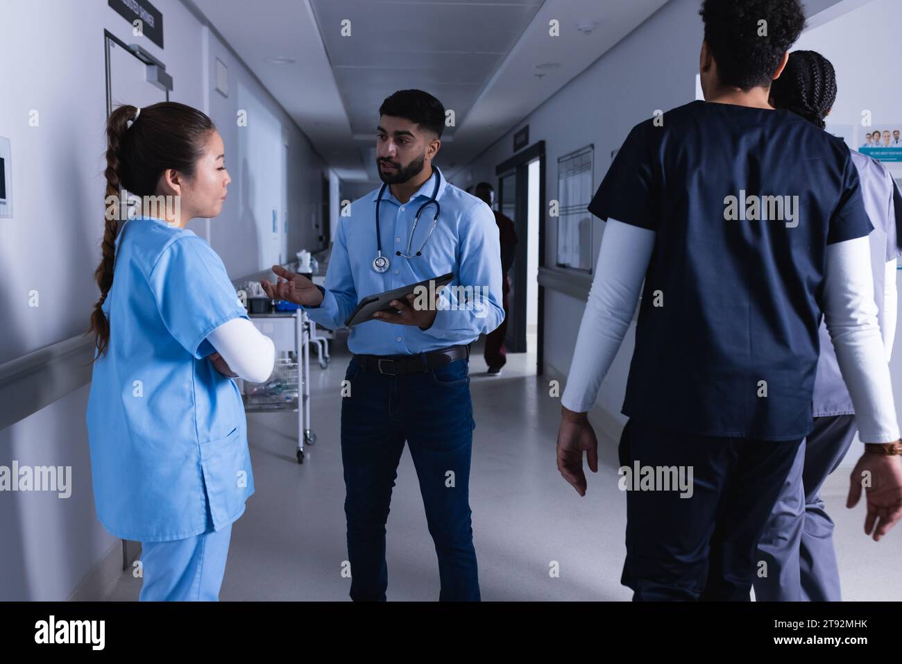 Diverse female doctors using tablet hi-res stock photography and images ...