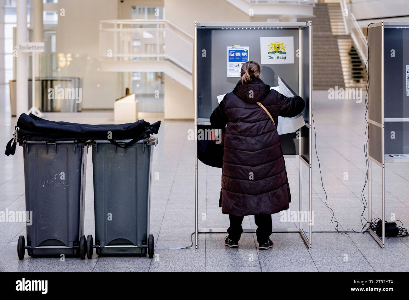 Netherlands. 22nd Nov, 2023. THE HAGUE - People at a voting location for the House of Representatives elections at the city hall in The Hague. ANP REMKO DE WAAL netherlands out - belgium out Credit: ANP/Alamy Live News Stock Photo