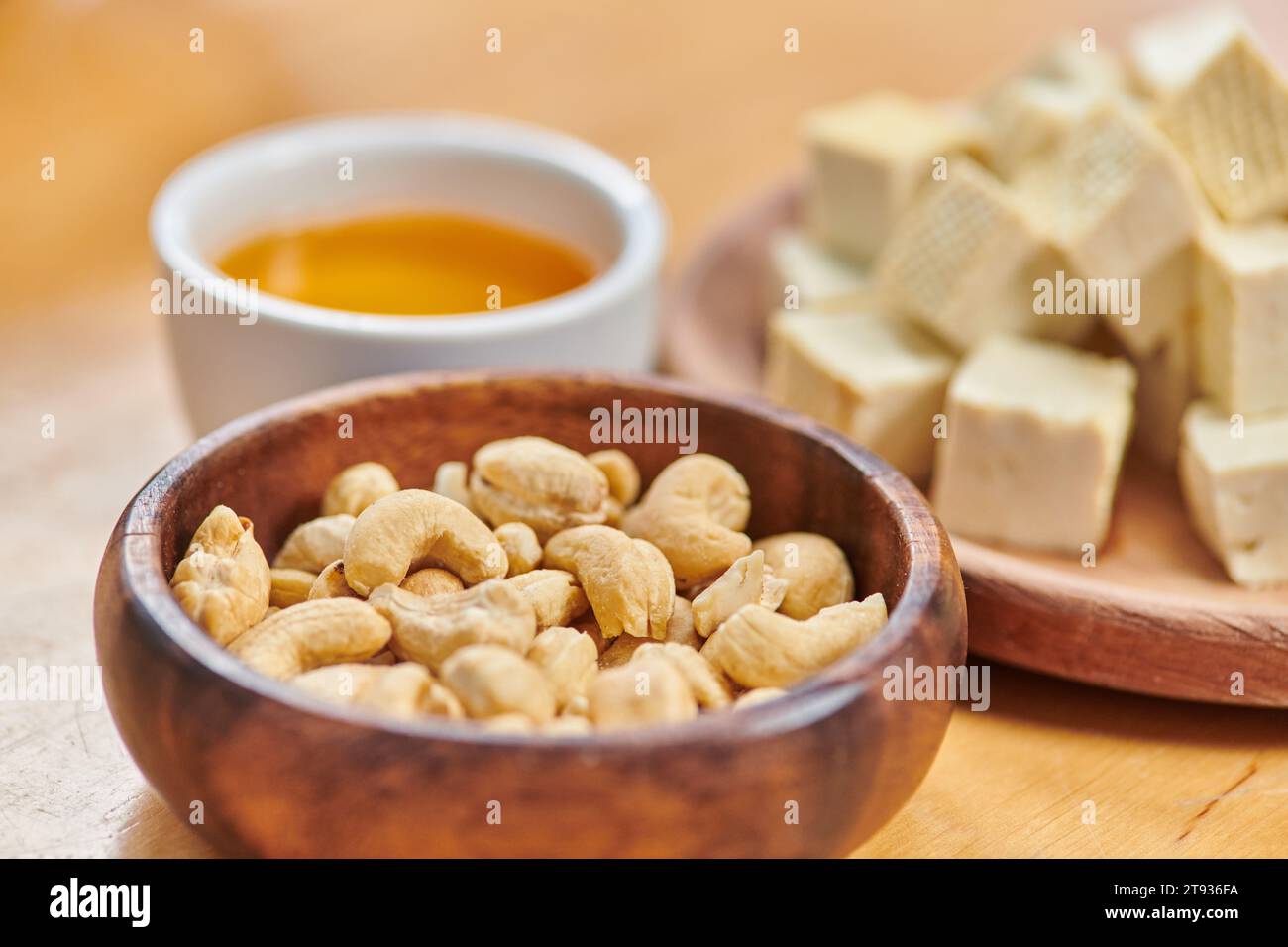 plantbased diets concept, close up of cashew nuts and diced tofu