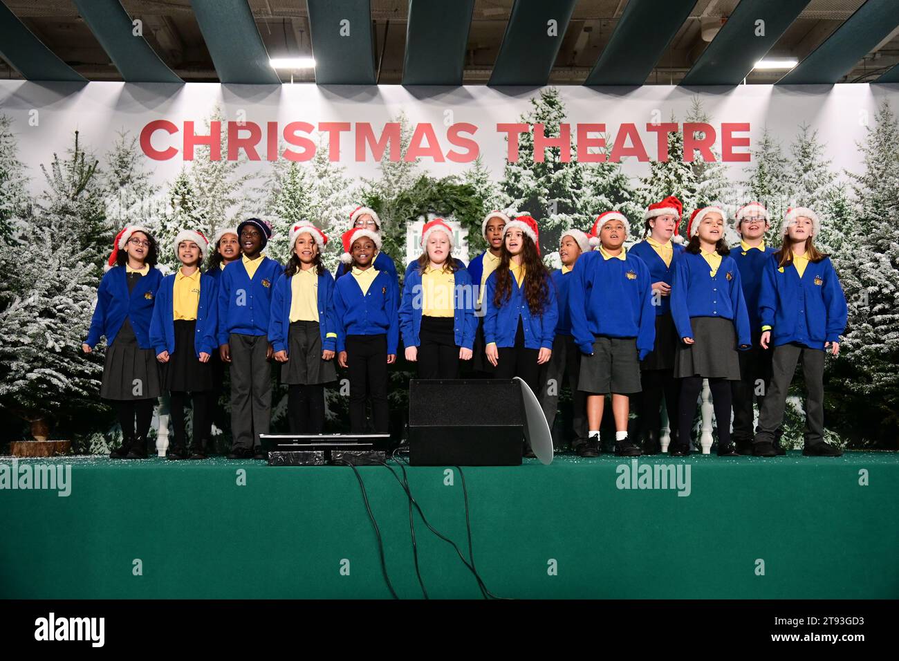 London, UK. 22nd Nov, 2023. Mama G presenter at the Avonmore Primary School, Sir John Lillie Primary School, and Flora Gardens Primary School compete in the great Christmas w-Rap Battle at the opening day of the Ideal Home Show Christmas, Olympia London, London, UK. Credit: See Li/Picture Capital/Alamy Live News Stock Photo