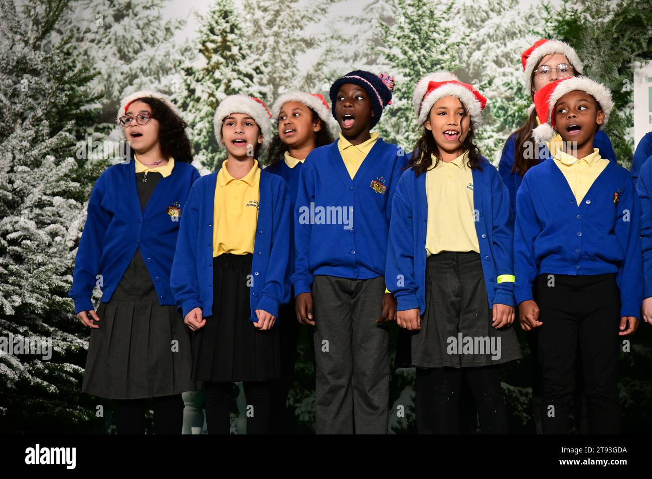 London, UK. 22nd Nov, 2023. Mama G presenter at the Avonmore Primary School, Sir John Lillie Primary School, and Flora Gardens Primary School compete in the great Christmas w-Rap Battle at the opening day of the Ideal Home Show Christmas, Olympia London, London, UK. Credit: See Li/Picture Capital/Alamy Live News Stock Photo