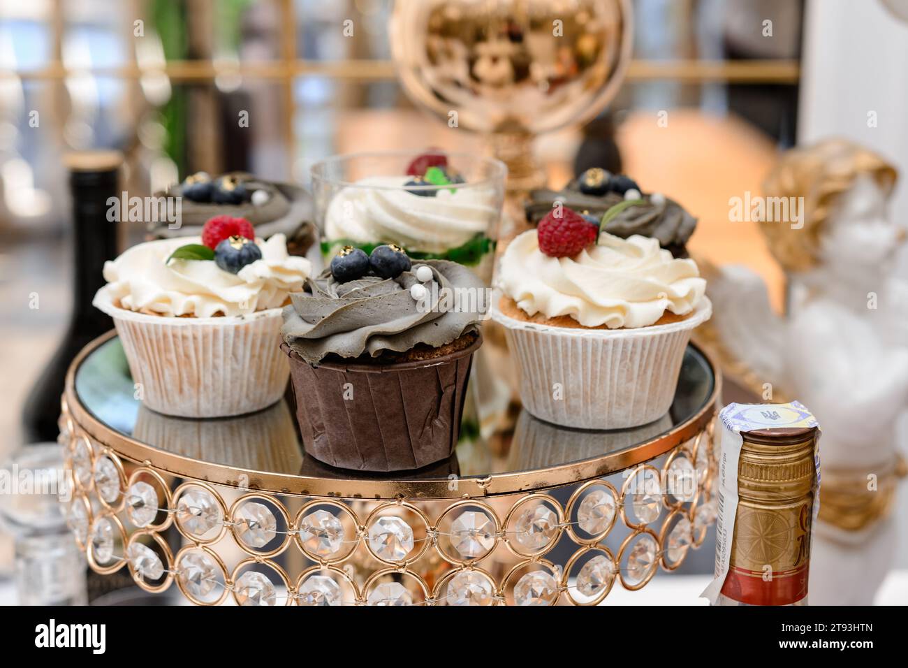 Decoration of a candy bar with various sweets at a festive event, desserts on the table. Stock Photo