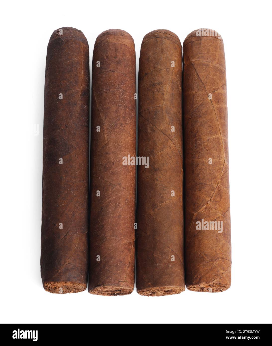 Cigars wrapped in tobacco leaves isolated on white, top view Stock