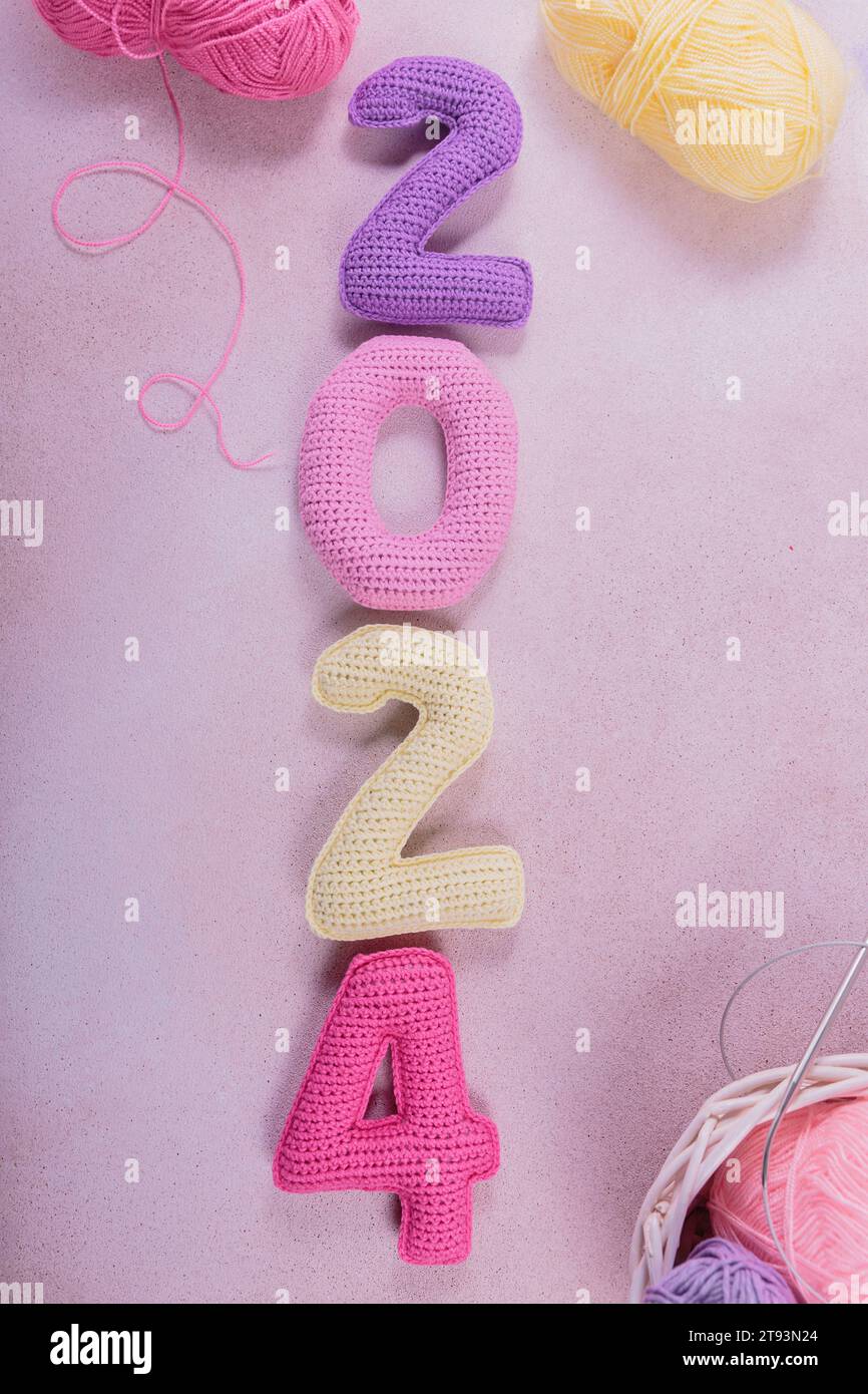 New Years Background With Multicolored Crochet Numbers 2024 Stock Photo   New Years Background With Multicolored Crochet Numbers 2024 2T93N24 