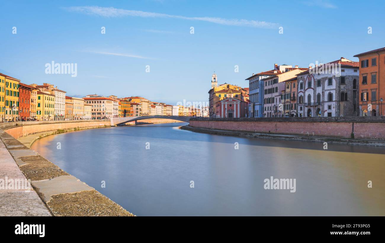 Pisa city, Arno river, Ponte di Mezzo bridge. Lungarno view. Tuscany region, Italy, Europe. Long exposure photograph Stock Photo