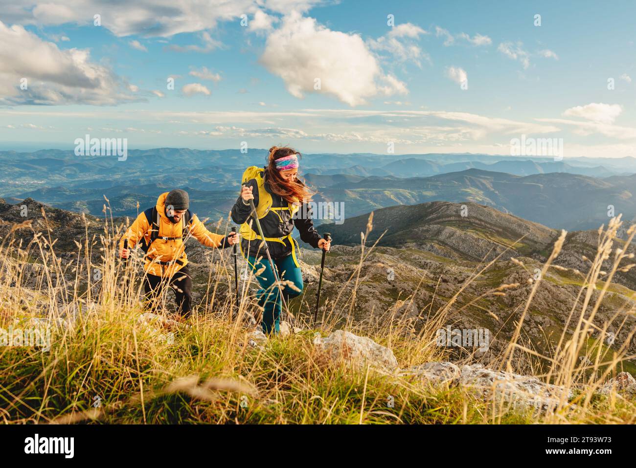 Happy man woman sticks trekking hi-res stock photography and images - Alamy