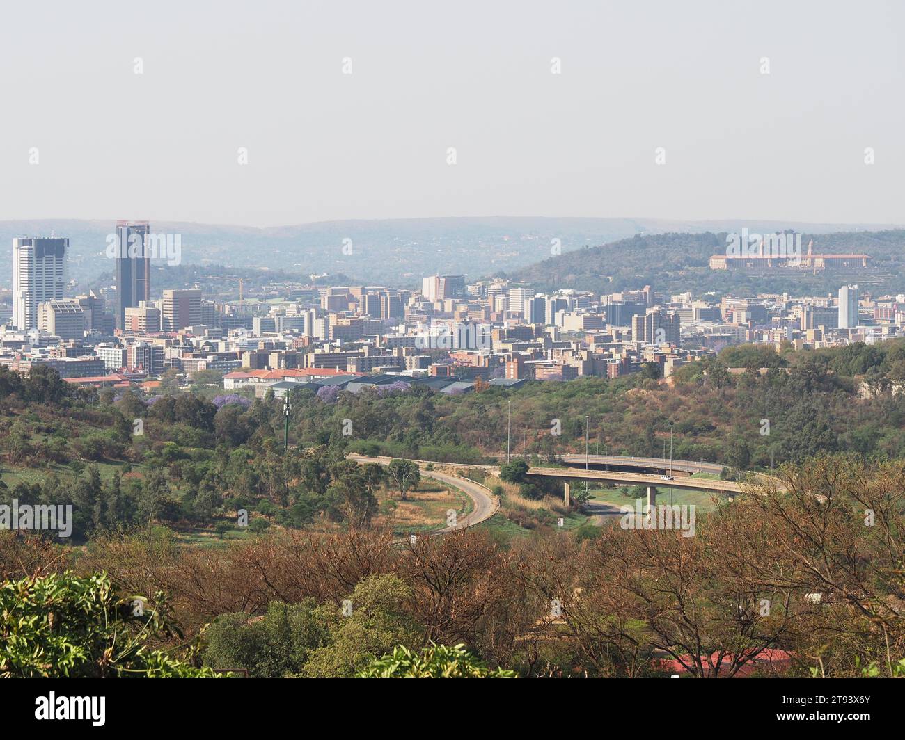 The city of Pretoria, the administrative capital, seen from a distance with highways and nature in the foreground. Pretoria, Gauteng, South Africa. Stock Photo