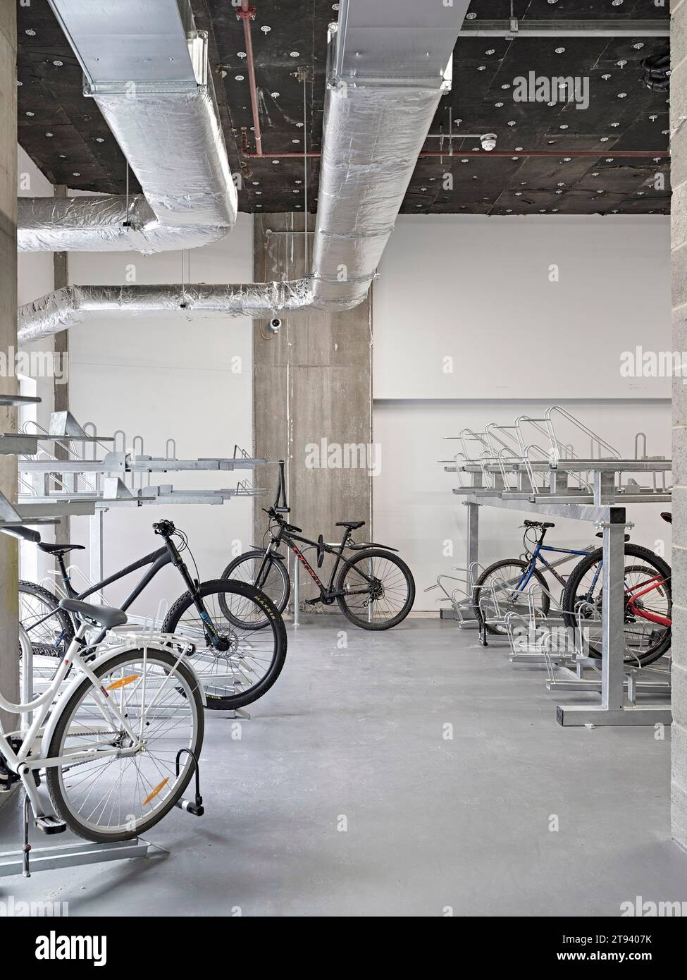 Basement bicycle storage. Altus House, Leeds, United Kingdom. Architect