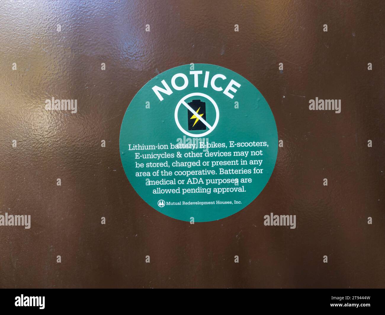 A Sign At The Entrance Of An Apartment Building In New York Prohibits a-sign-at-the-entrance-of-an-apartment-building-in-new-york-prohibits
