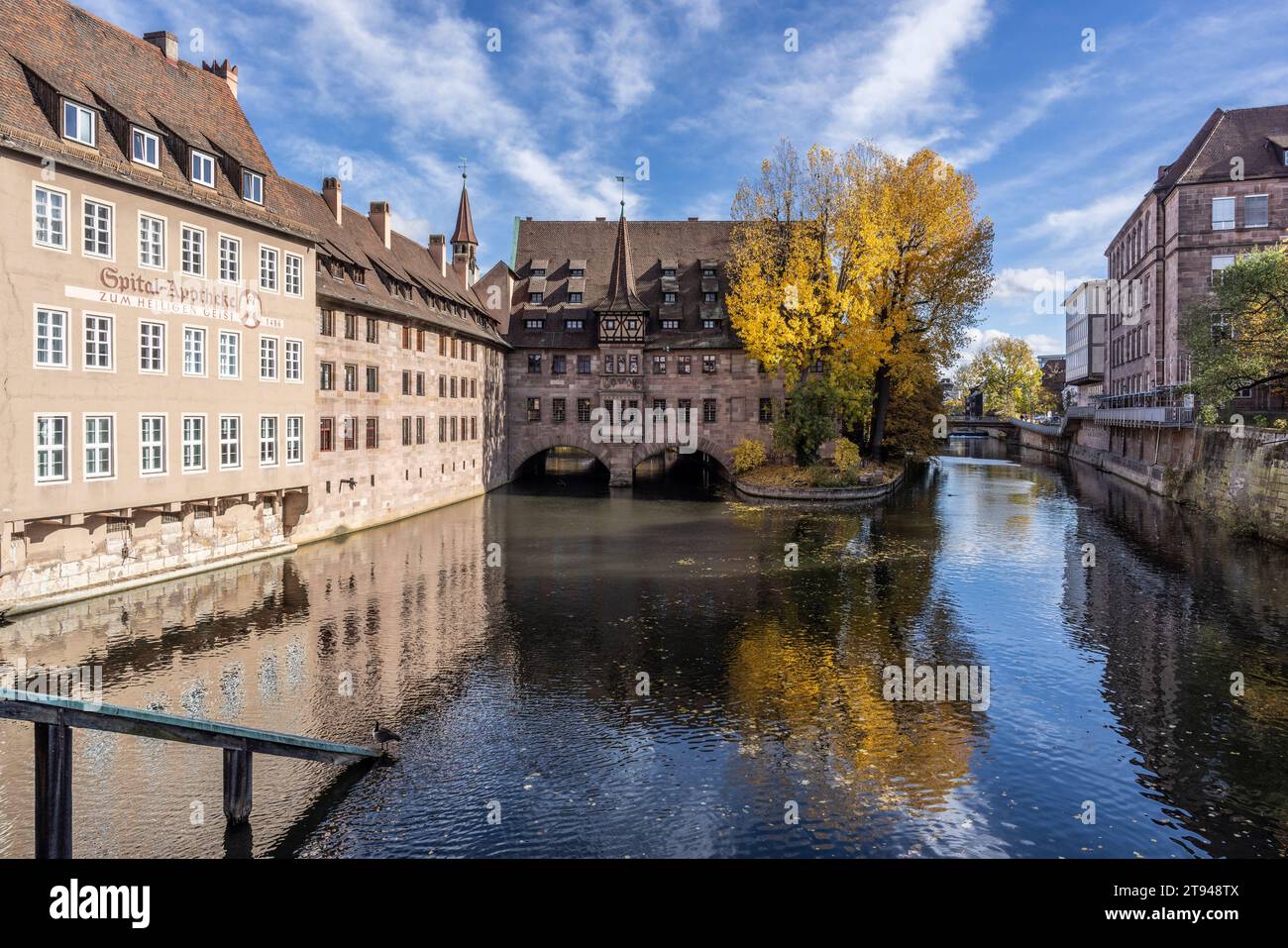 Heilig-Geist-Spital (Holy Spirit Hospital) and Pegnitz River from Museumbrucke, Old Town, Nuremberg, Germany Stock Photo