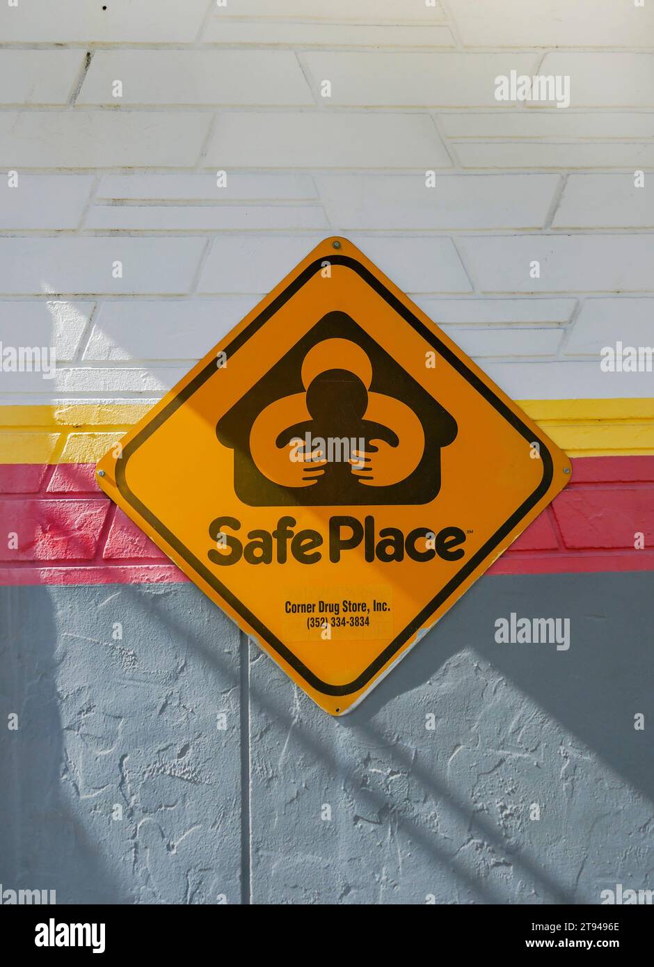 Safe Place sign posted on the side of a business in a small North Florida town. Stock Photo