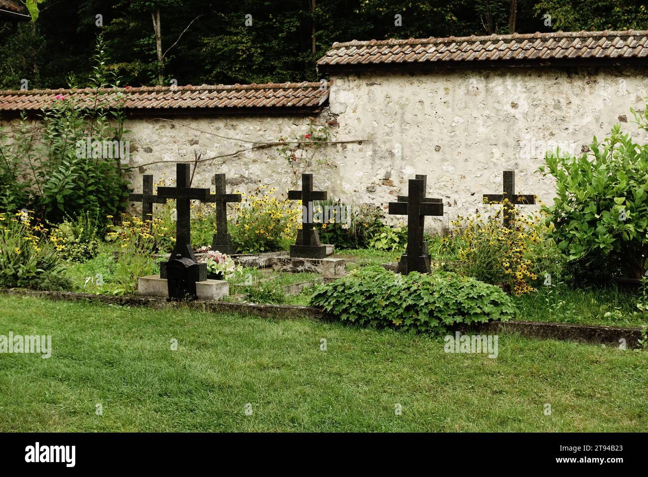 black granite crosses in small cemetery of Raca Monastery, Serbia Stock Photo