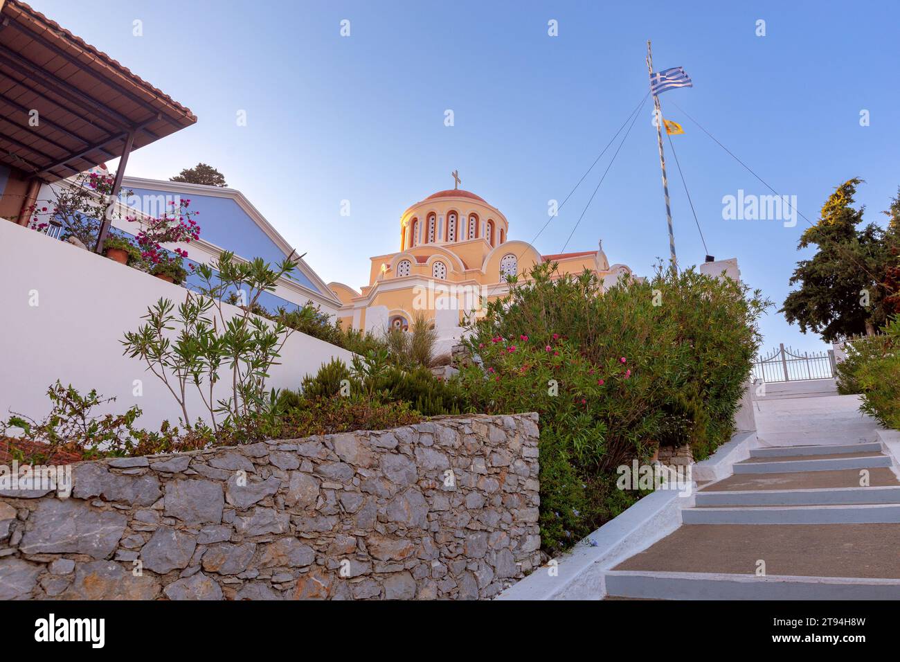 Beautiful traditional Greek Orthodox Church of the Annunciation at sunset. Symi Island. Greece. Stock Photo
