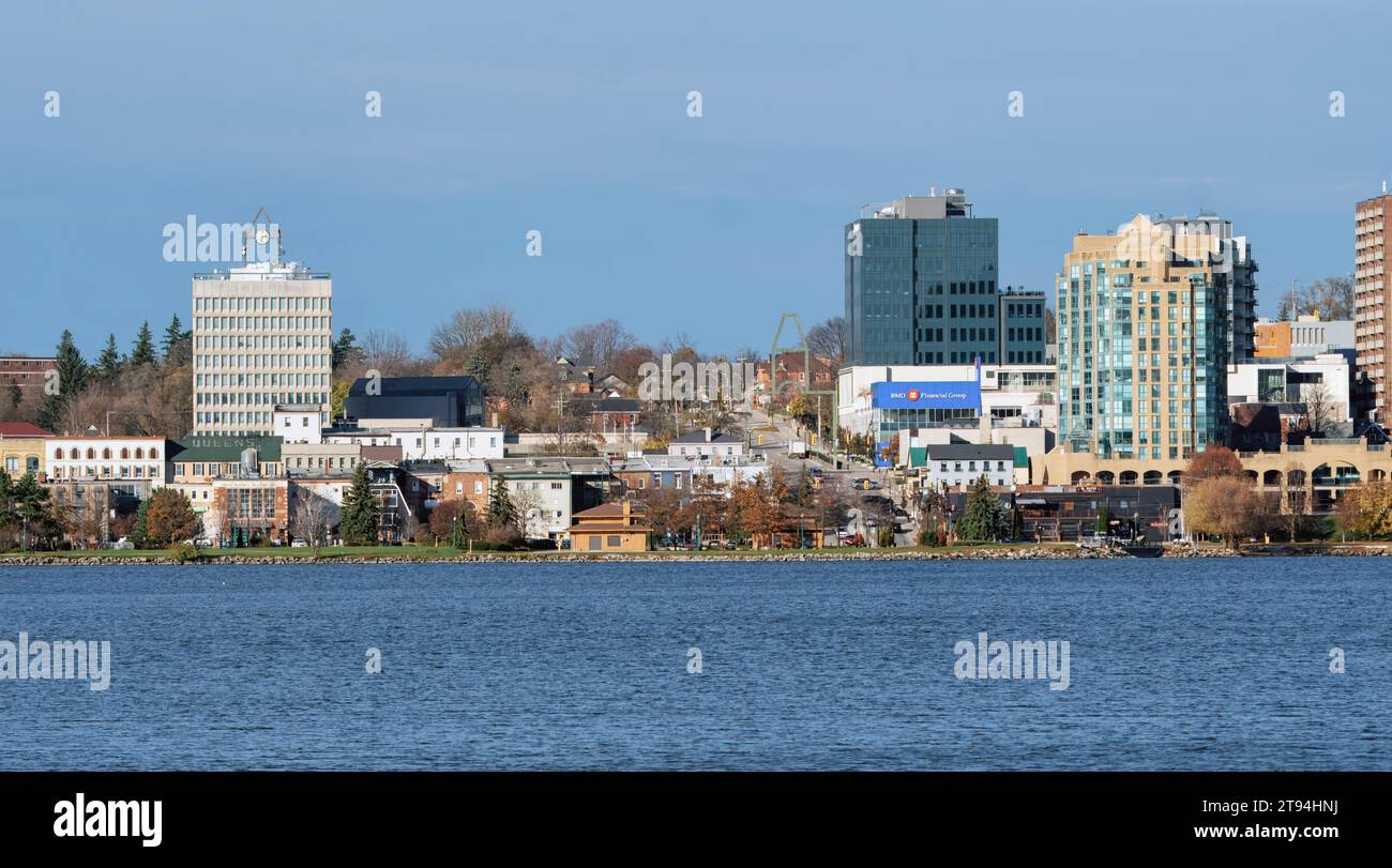 Barrie, Ontario/Canada - November 15, 2023: City Hall Clock Tower and commercial and residential buildings over Kempenfelt Bay, Lake Simcoe at dusk Stock Photo