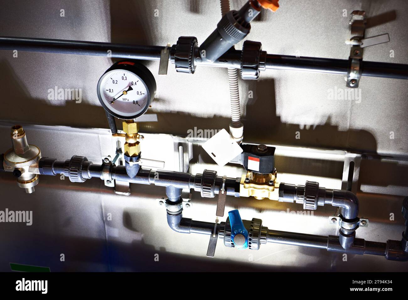 Installation of plastic pipes for water pipelines and pressure gauge